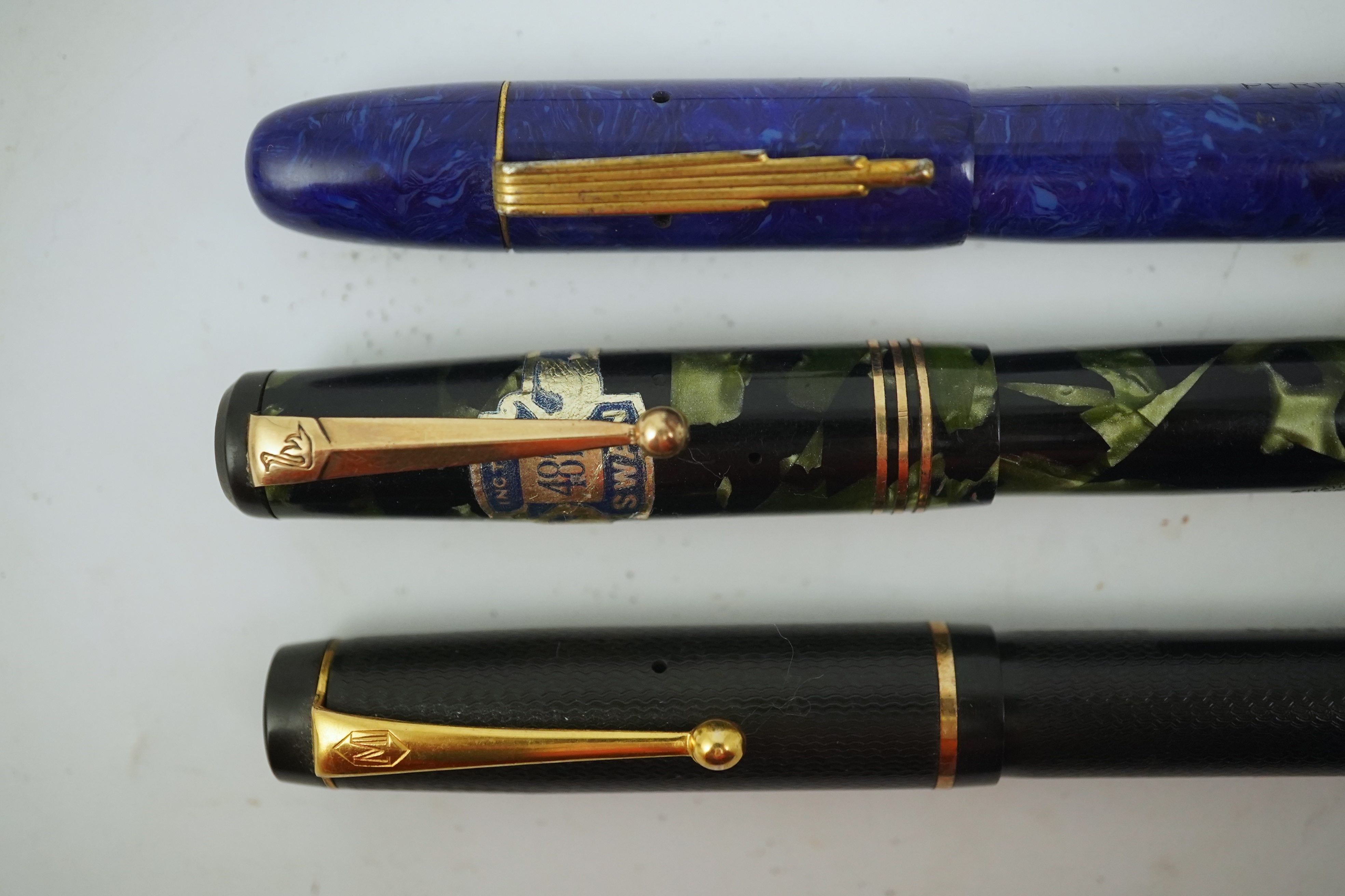 A Wyvern Perfect, No. 81, a Mentmore Autoflow fountain pen and a Mabie Todd Swan fountain pen. Condition - fair to good